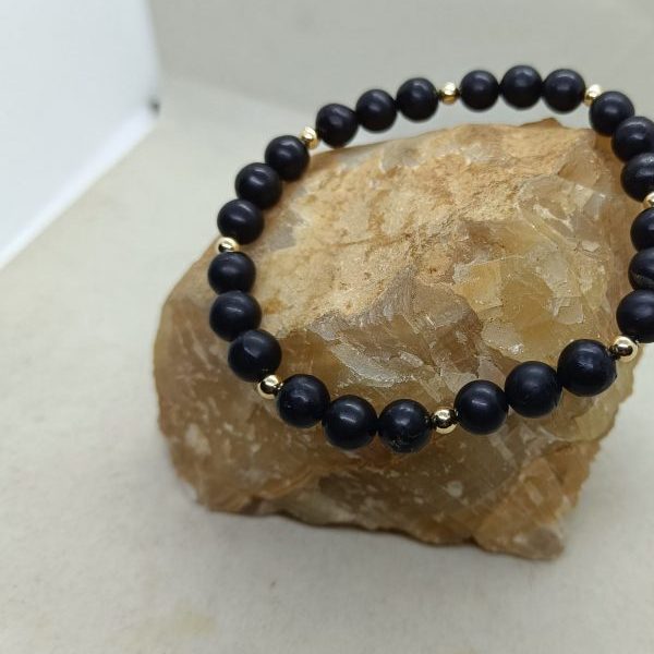 Pulsera Sughnita y oro de 14 k